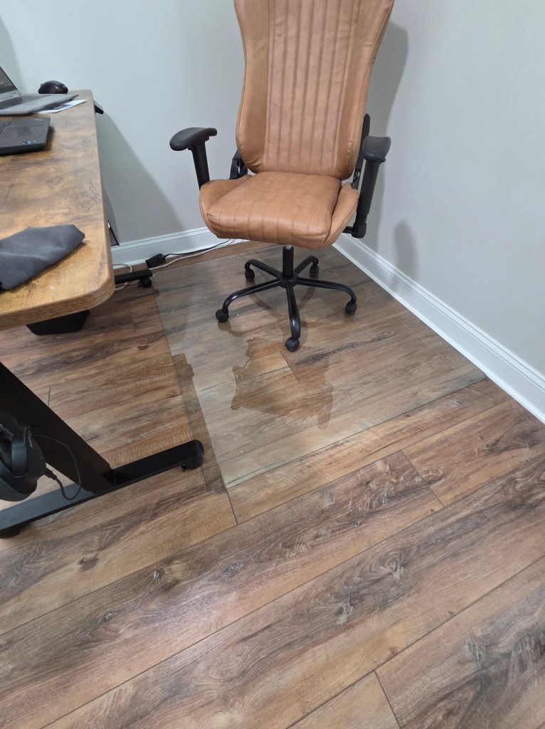 Tempered glass chair mat under an office chair on hardwood floors